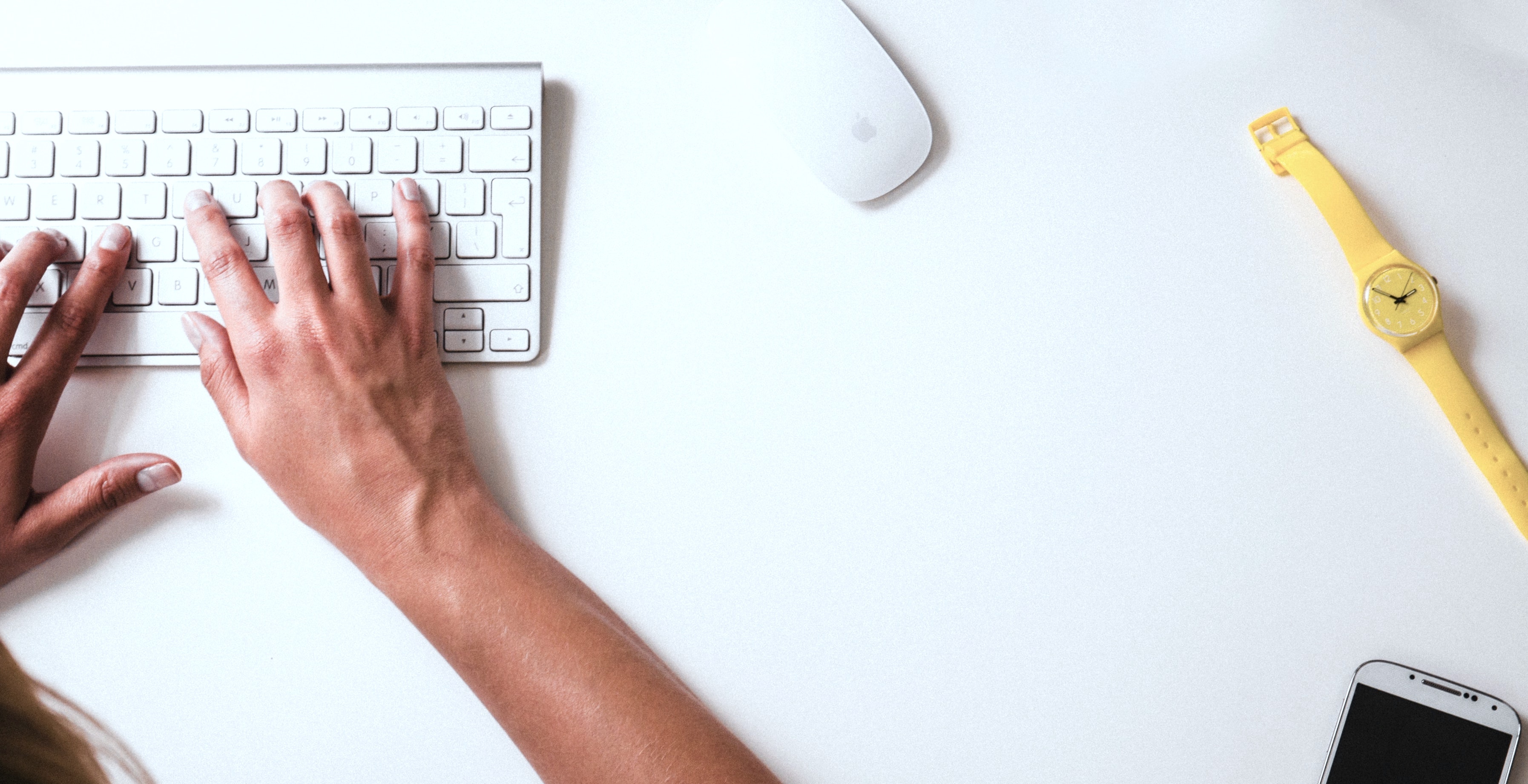 woman typing on mac